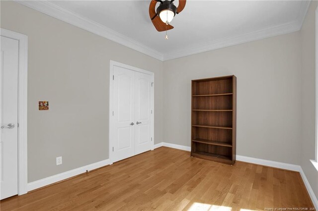 3207 Notting Hill Rd, Fayetteville, NC 28311 - unfurnished bedroom featuring wood finished floors, baseboards, crown molding, a closet, and a ceiling fan