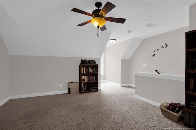 3207 Notting Hill Rd, Fayetteville, NC 28311 - additional living space with carpet flooring, a ceiling fan, vaulted ceiling, and baseboards