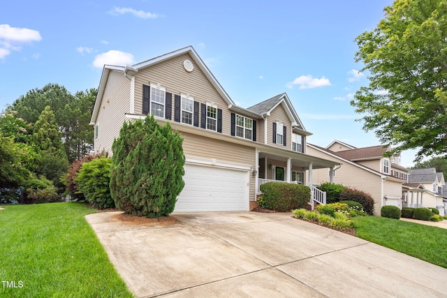 1428 White Opal Dr, Knightdale, NC 27545 - traditional-style home with covered porch, an attached garage, a front yard, and concrete driveway