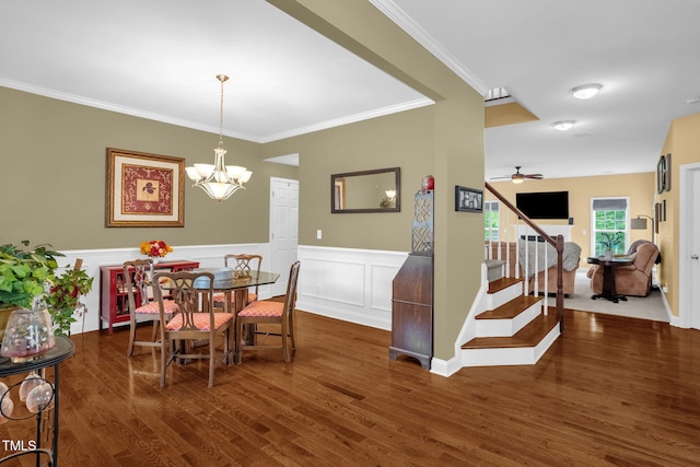 1428 White Opal Dr, Knightdale, NC 27545 - dining space featuring wood finished floors, ornamental molding, stairway, a wainscoted wall, and a chandelier