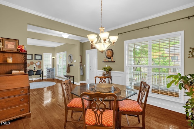 1428 White Opal Dr, Knightdale, NC 27545 - dining area with wood finished floors, ornamental molding, plenty of natural light, and a chandelier