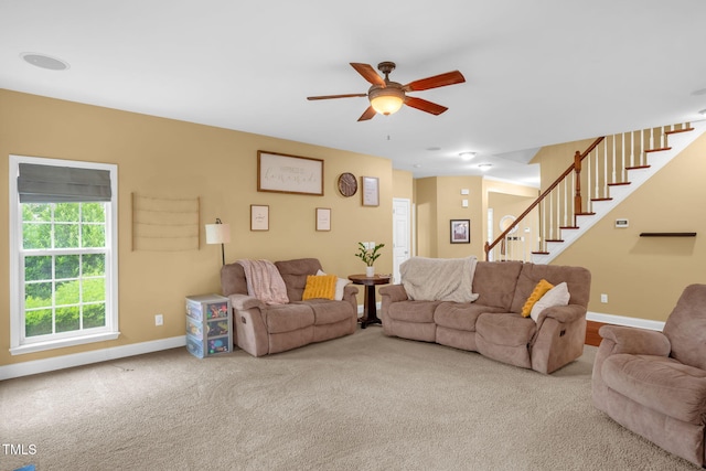 1428 White Opal Dr, Knightdale, NC 27545 - living room with stairs, ceiling fan, baseboards, and carpet flooring