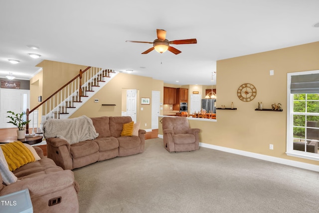 1428 White Opal Dr, Knightdale, NC 27545 - living room featuring stairway, a ceiling fan, carpet, and baseboards