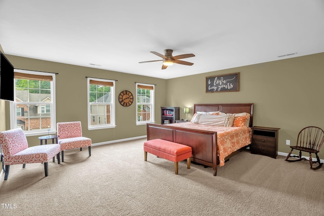 1428 White Opal Dr, Knightdale, NC 27545 - carpeted bedroom featuring multiple windows, baseboards, and a ceiling fan