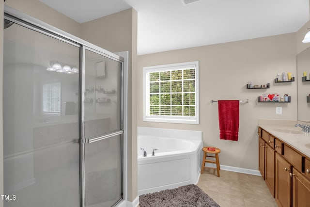 1428 White Opal Dr, Knightdale, NC 27545 - bathroom with vanity, a shower stall, a bath, and baseboards