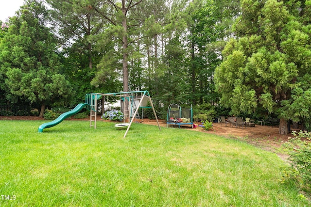 1428 White Opal Dr, Knightdale, NC 27545 - view of jungle gym with a trampoline, a yard, and view of wooded area