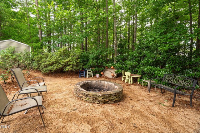 1428 White Opal Dr, Knightdale, NC 27545 - view of yard featuring an outdoor fire pit
