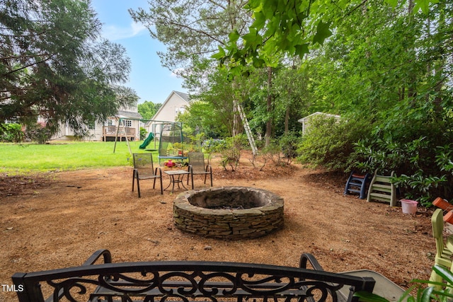 1428 White Opal Dr, Knightdale, NC 27545 - view of green lawn featuring a fire pit and a playground