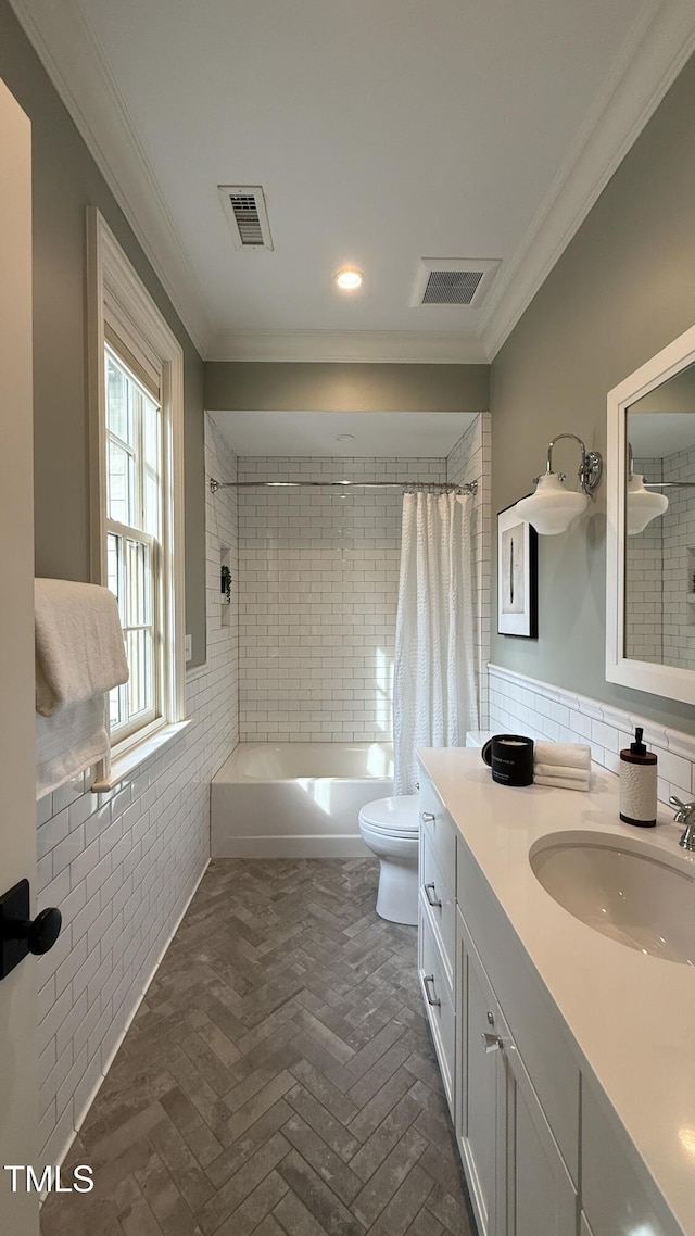 800 Lakestone Dr, Raleigh, NC 27609 - full bathroom featuring ornamental molding, vanity, shower / tub combo, recessed lighting, and tile walls