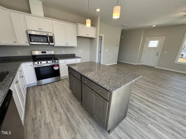 140 Brookhaven Dr, Spring Hope, NC 27882 - kitchen with stainless steel appliances, light wood-style flooring, white cabinetry, and recessed lighting