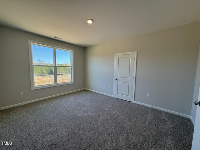 140 Brookhaven Dr, Spring Hope, NC 27882 - empty room with dark colored carpet and baseboards