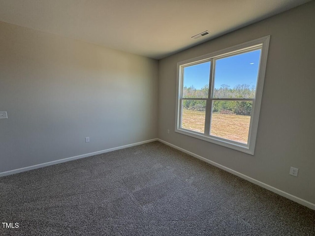 140 Brookhaven Dr, Spring Hope, NC 27882 - unfurnished room featuring baseboards and dark colored carpet
