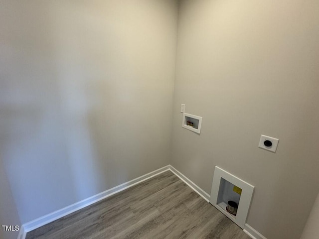 140 Brookhaven Dr, Spring Hope, NC 27882 - laundry room with electric dryer hookup, hookup for a washing machine, wood finished floors, and baseboards