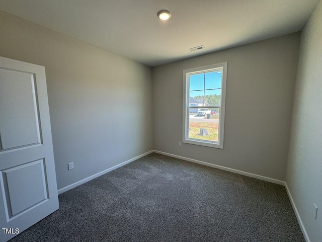 140 Brookhaven Dr, Spring Hope, NC 27882 - spare room with dark carpet and baseboards