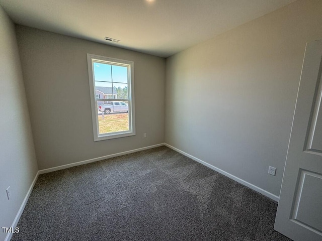 140 Brookhaven Dr, Spring Hope, NC 27882 - unfurnished room with dark carpet and baseboards