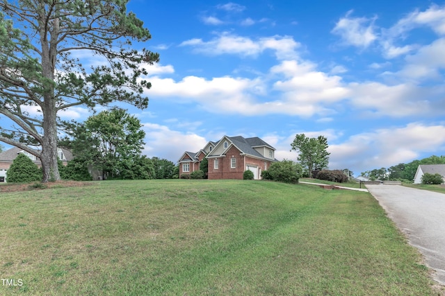 7800 Twin Pines Way, Fuquay Varina, NC 27526 - view of front of home with brick siding, a front yard, and driveway