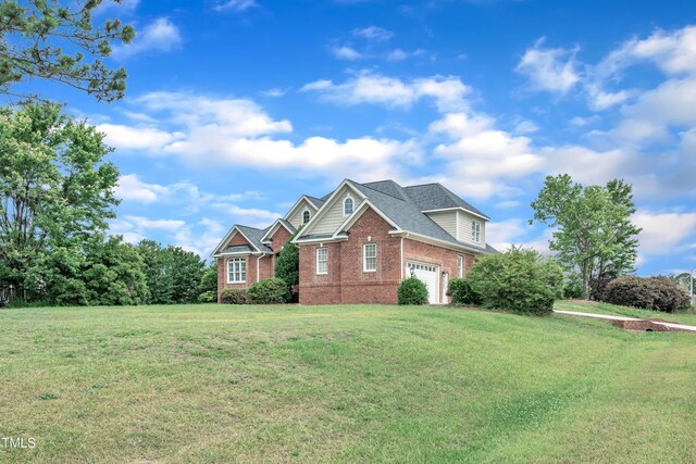 7800 Twin Pines Way, Fuquay Varina, NC 27526 - view of front facade featuring brick siding and a front yard