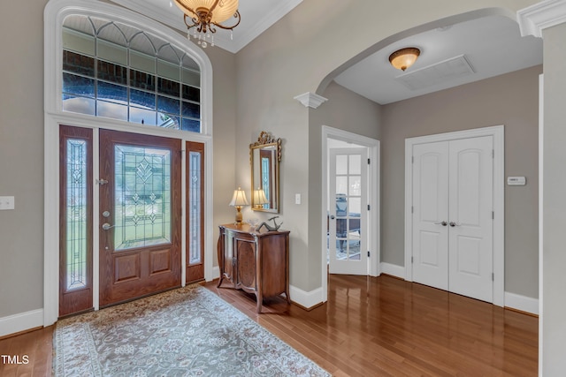 7800 Twin Pines Way, Fuquay Varina, NC 27526 - entryway with arched walkways, wood finished floors, and baseboards