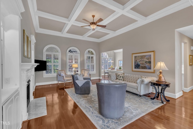 7800 Twin Pines Way, Fuquay Varina, NC 27526 - living room with ceiling fan, coffered ceiling, baseboards, a fireplace with flush hearth, and wood finished floors