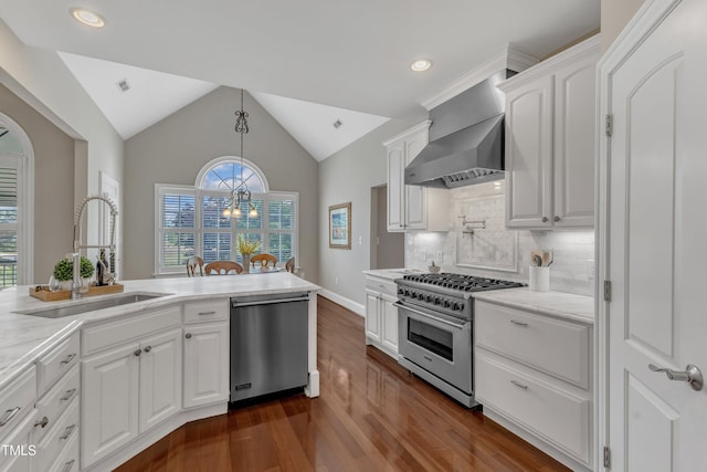 7800 Twin Pines Way, Fuquay Varina, NC 27526 - kitchen featuring appliances with stainless steel finishes, a sink, wall chimney range hood, dark wood finished floors, and white cabinetry