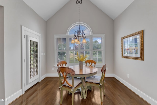 7800 Twin Pines Way, Fuquay Varina, NC 27526 - dining space featuring a chandelier, wood finished floors, baseboards, and lofted ceiling
