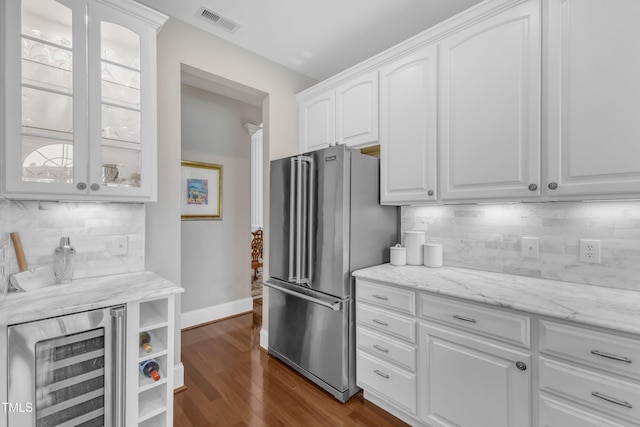 7800 Twin Pines Way, Fuquay Varina, NC 27526 - kitchen featuring high quality fridge, wine cooler, white cabinetry, and glass insert cabinets