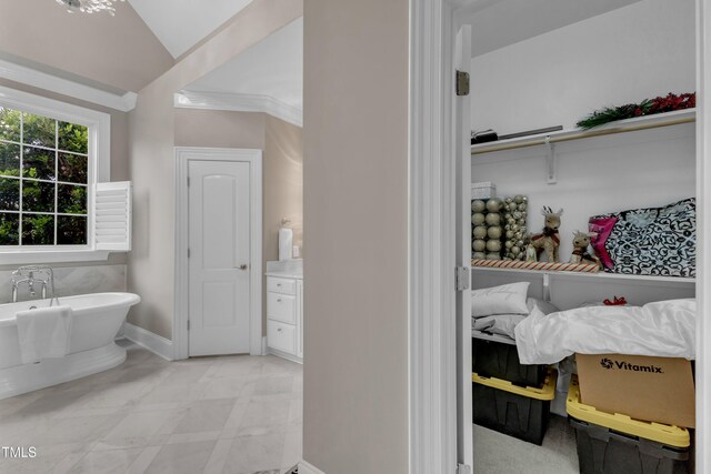 7800 Twin Pines Way, Fuquay Varina, NC 27526 - full bathroom featuring a freestanding tub, lofted ceiling, and baseboards
