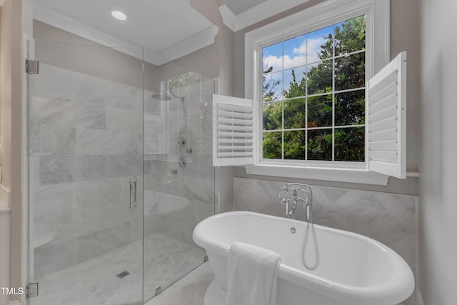 7800 Twin Pines Way, Fuquay Varina, NC 27526 - bathroom with a soaking tub, a shower stall, crown molding, and tile walls