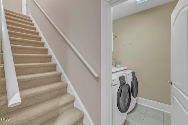 7800 Twin Pines Way, Fuquay Varina, NC 27526 - washroom with washing machine and clothes dryer, light tile patterned floors, and baseboards