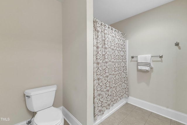 7800 Twin Pines Way, Fuquay Varina, NC 27526 - bathroom featuring toilet, baseboards, tile patterned flooring, and a shower with curtain