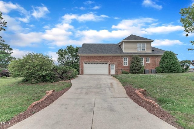 7800 Twin Pines Way, Fuquay Varina, NC 27526 - view of front of house with brick siding, concrete driveway, a front lawn, a garage, and roof with shingles