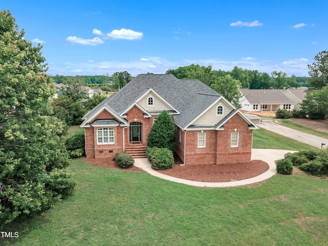 7800 Twin Pines Way, Fuquay Varina, NC 27526 - view of front of home with brick siding, a front yard, and driveway