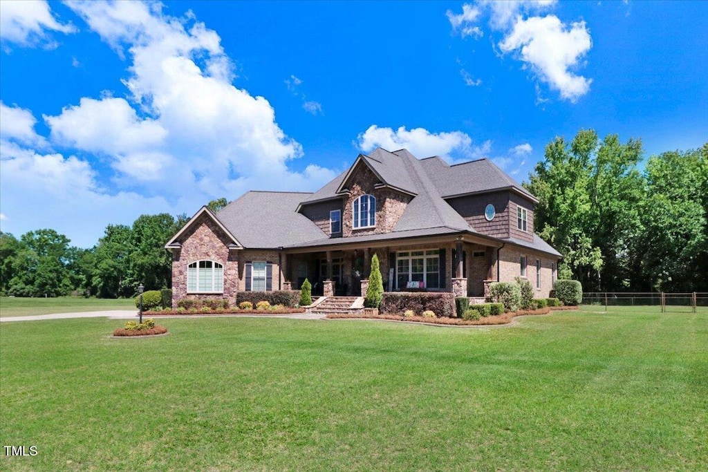 479 Perkins Rd, Goldsboro, NC 27530 - craftsman-style home with stone siding and covered porch