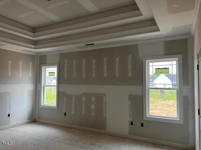 129 Retreat Run, Smithfield, NC 27577 - empty room featuring ornamental molding and a tray ceiling