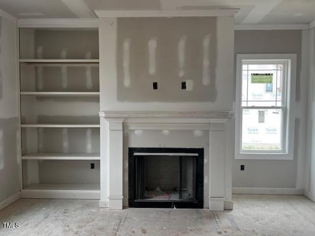 129 Retreat Run, Smithfield, NC 27577 - detailed view of crown molding, a fireplace, and baseboards