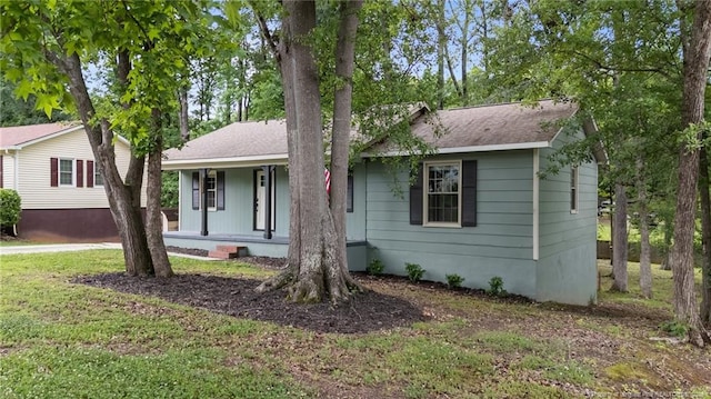 2308 Keith Dr, Raleigh, NC 27610 - view of front of home with a porch and a shingled roof