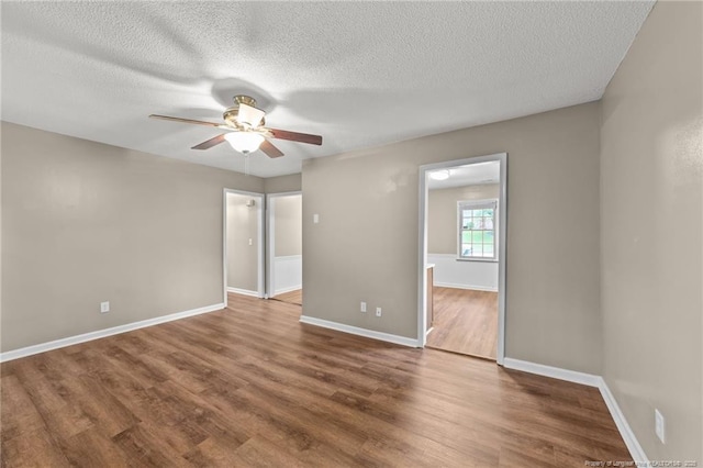 2308 Keith Dr, Raleigh, NC 27610 - unfurnished room featuring ceiling fan, wood finished floors, a textured ceiling, and baseboards