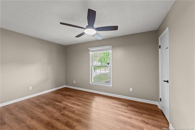 2308 Keith Dr, Raleigh, NC 27610 - spare room featuring wood finished floors, baseboards, ceiling fan, and a textured ceiling