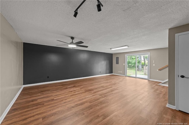 2308 Keith Dr, Raleigh, NC 27610 - spare room with a textured ceiling, wood finished floors, baseboards, and a ceiling fan