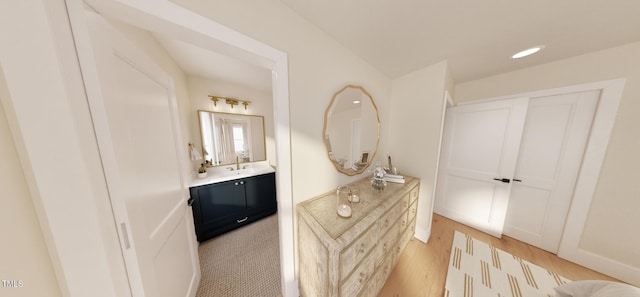 2940C Chapel Hill Rd, Durham, NC 27707 - bathroom with vanity, wood finished floors, and recessed lighting