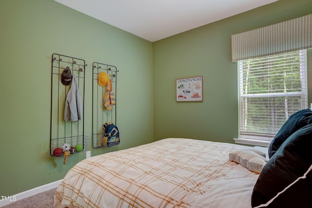 128 Bruce Dr, Dunn, NC 28334 - carpeted bedroom with multiple windows and baseboards