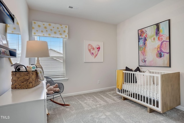 128 Bruce Dr, Dunn, NC 28334 - carpeted bedroom with multiple windows, a crib, and baseboards