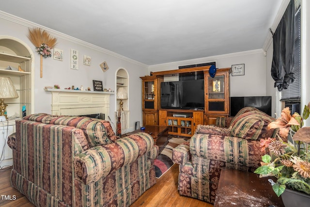 940 Hill St, Rocky Mount, NC 27801 - living area with wood finished floors, crown molding, a fireplace, and built in features