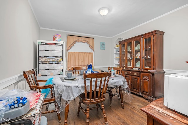 940 Hill St, Rocky Mount, NC 27801 - dining area featuring ornamental molding, wood finished floors, and a wainscoted wall