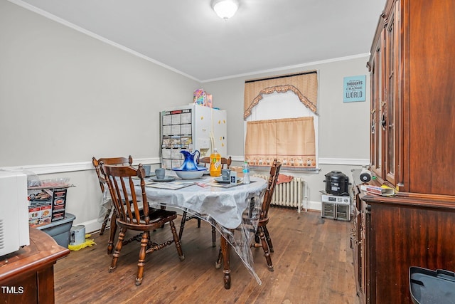 940 Hill St, Rocky Mount, NC 27801 - dining area with radiator, crown molding, and wood finished floors