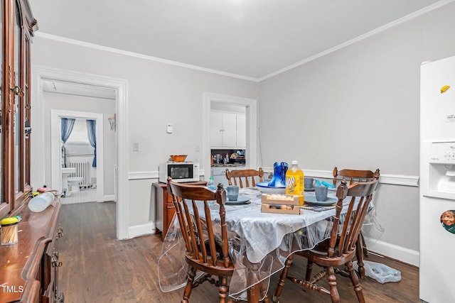 940 Hill St, Rocky Mount, NC 27801 - dining space featuring wood finished floors, crown molding, and baseboards