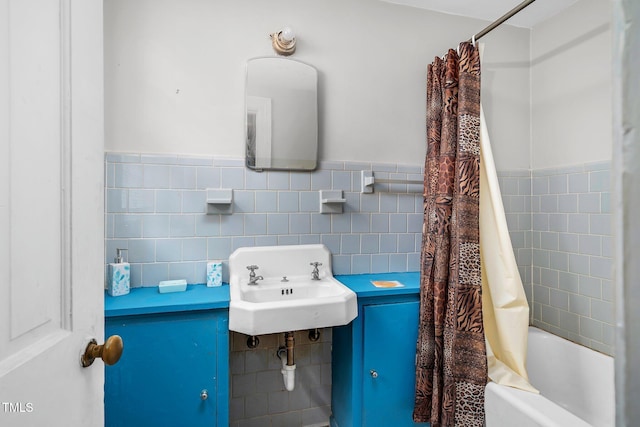 940 Hill St, Rocky Mount, NC 27801 - full bathroom with tile walls, a sink, shower / tub combo, and wainscoting
