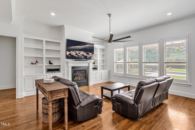 6250 Moinear Ln, Chapel Hill, NC 27514 - living area with crown molding, baseboards, ceiling fan, plenty of natural light, and a glass covered fireplace
