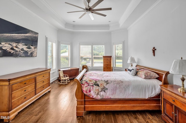 6250 Moinear Ln, Chapel Hill, NC 27514 - bedroom with a tray ceiling, dark wood finished floors, crown molding, and a ceiling fan