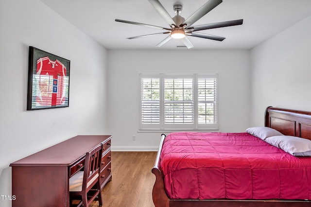 6250 Moinear Ln, Chapel Hill, NC 27514 - bedroom with wood finished floors, baseboards, and a ceiling fan
